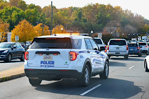 Fairfax, Virginia, USA - October 26, 2023: A City of Fairfax Police cruiser responds to an emergency vehicle accident near Fairfax Circle.