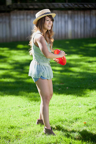 istock Happy Young Asian Woman Frisbee 184840904
