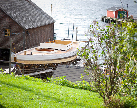A beautiful traditional wood schooner under construction in Lunenburg Nova Scotia.   Lunenburg is an UNESCO World Heritage Site.  Click to see more Lunenburg images.