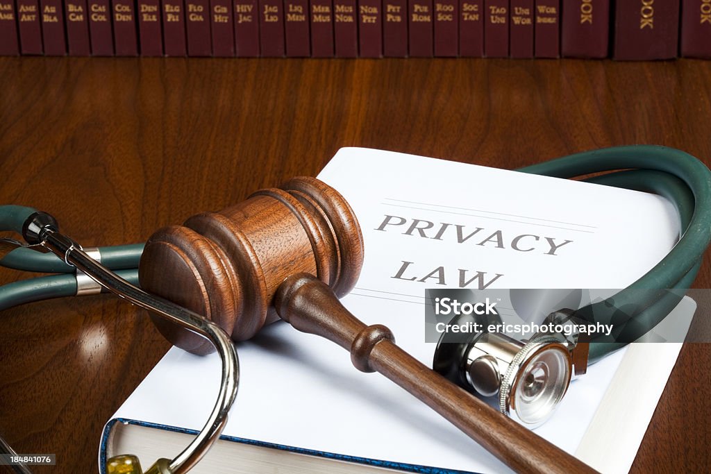 Privacy law stethoscope and gavel Judge's gavel and stethoscope on Privacy Law handbook. Beauty Stock Photo