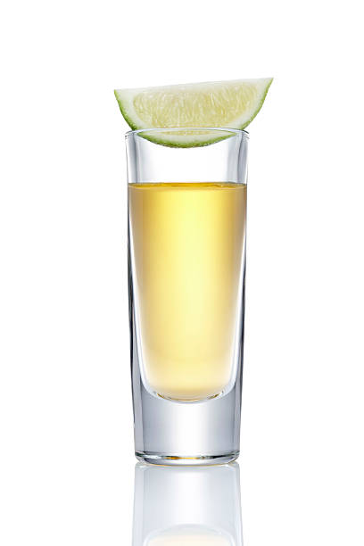 tequila slammer glass of tequila shot isolated on white tequila slammer stock pictures, royalty-free photos & images