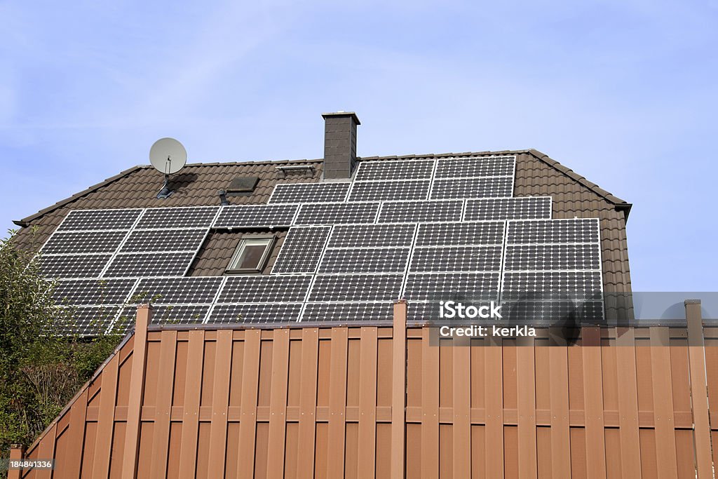 Solar Panels on roof a private house with solar panels on the roof Blue Stock Photo