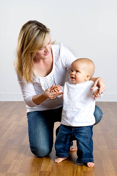 istock Mother Teaching her Baby to Walk 184841612