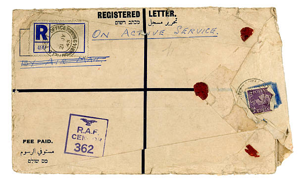 Scruffy registered envelope 'On Active Service' 1943 "An extremely torn and dirty registered envelope posted to England during World War Two by registered post and examined by an RAF censor: it would appear to originate in the Middle East. Dated 1943 with King George VI threepenny stamp, with text in Arabic, English and Hebrew." george vi stock pictures, royalty-free photos & images