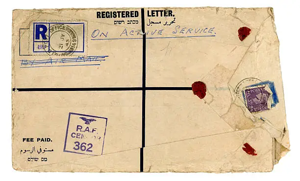 "An extremely torn and dirty registered envelope posted to England during World War Two by registered post and examined by an RAF censor: it would appear to originate in the Middle East. Dated 1943 with King George VI threepenny stamp, with text in Arabic, English and Hebrew."