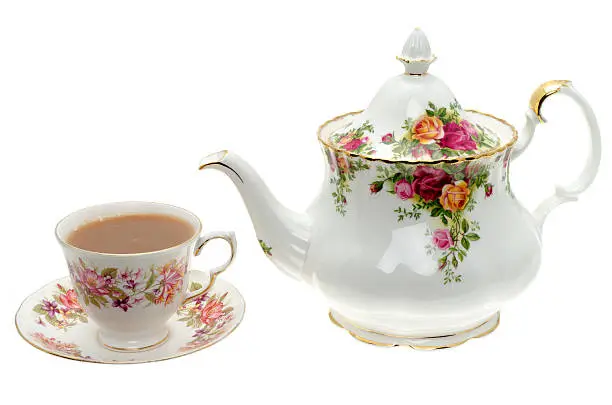 Photo of Vintage bone China teapot with a cup of tea.