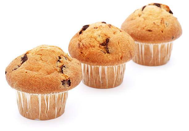 istock Three chocolate chip muffins in a row isolated on white 184843181