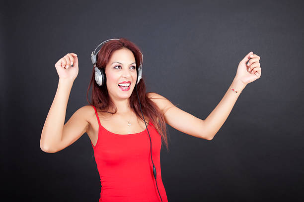 istock Dancing female in headphones 184843302