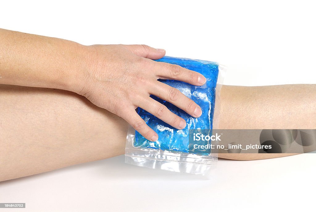 gel pack on knee "Cool gel pack on a swollen hurting knee.doctor, pain, injury and medicine" Adult Stock Photo