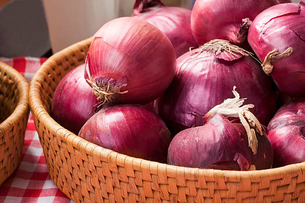 Red onions Red (spanish ) onions in straw basket; Adobe RGB color space;see other similar images: spanish onion stock pictures, royalty-free photos & images