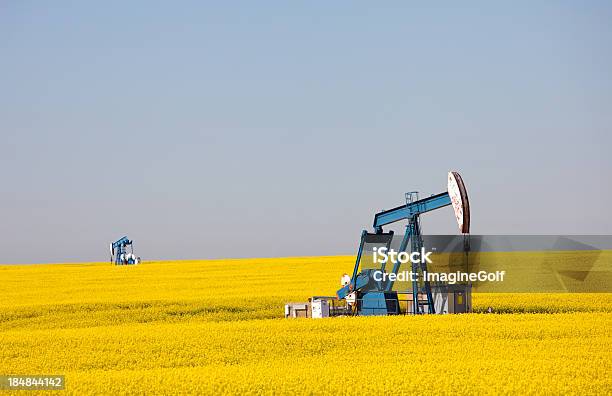 Two Pumpjacks On The Prairie Stock Photo - Download Image Now - Gasoline, Prairie, Alberta