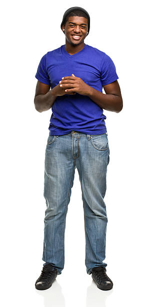 istock A happy young man standing and holding his hands together 184844279