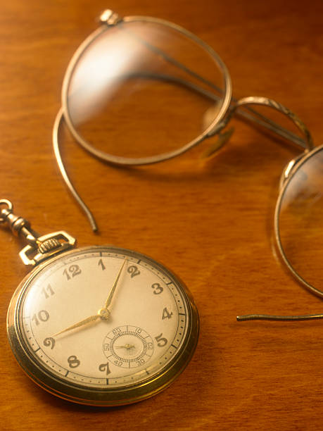 istock Antique gold watch with eyeglasses 184844390