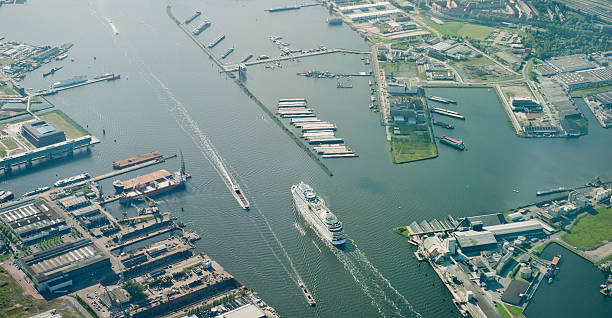 cruiseship entering the harbor of Amsterdam stock photo