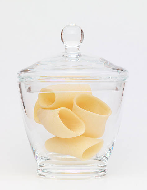 istock Pasta in glass jar on a white background 184844975