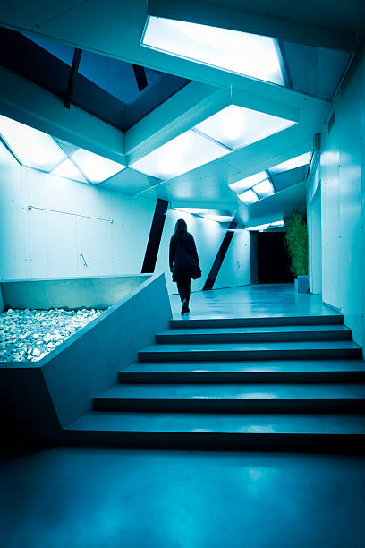 istock Woman walking in modern corridor 184845134