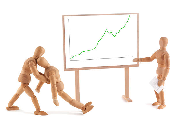 istock Wooden Mannequin and business graph 184845364