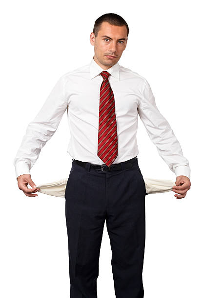 Businessman showing empty pockets Businessman showing empty pockets empty pockets stock pictures, royalty-free photos & images