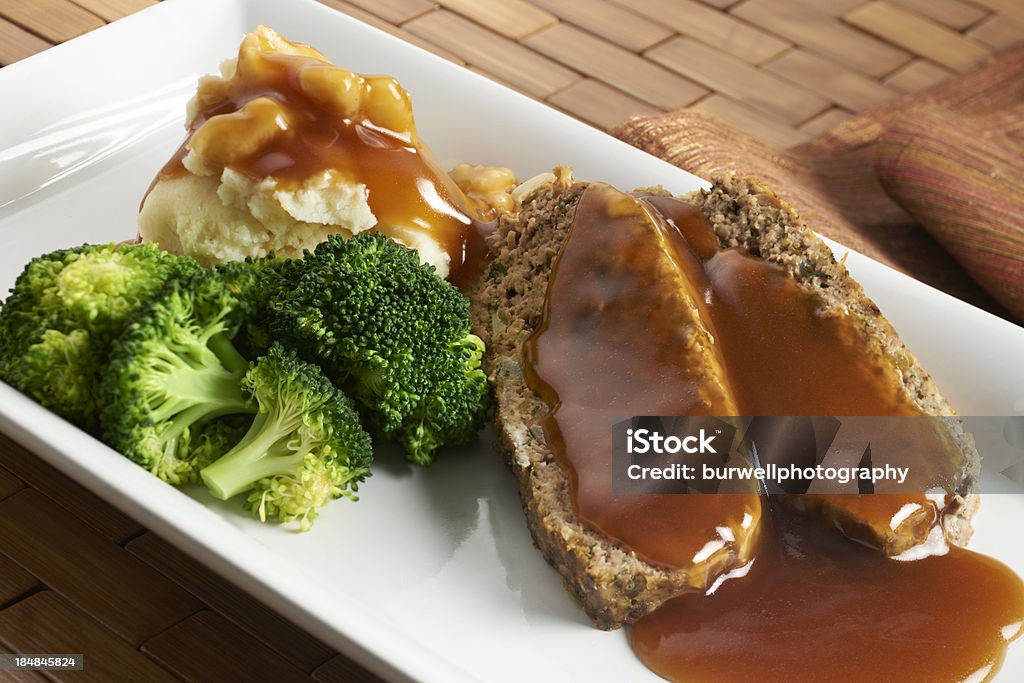 Meatloaf with mashed potatoes "Comfort food, home style. Two sliced of meatloaf with mashed potatoes, gravy and steamed broccoli." Meat Loaf - Food Stock Photo