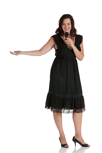 istock Woman singing into a microphone 184846056