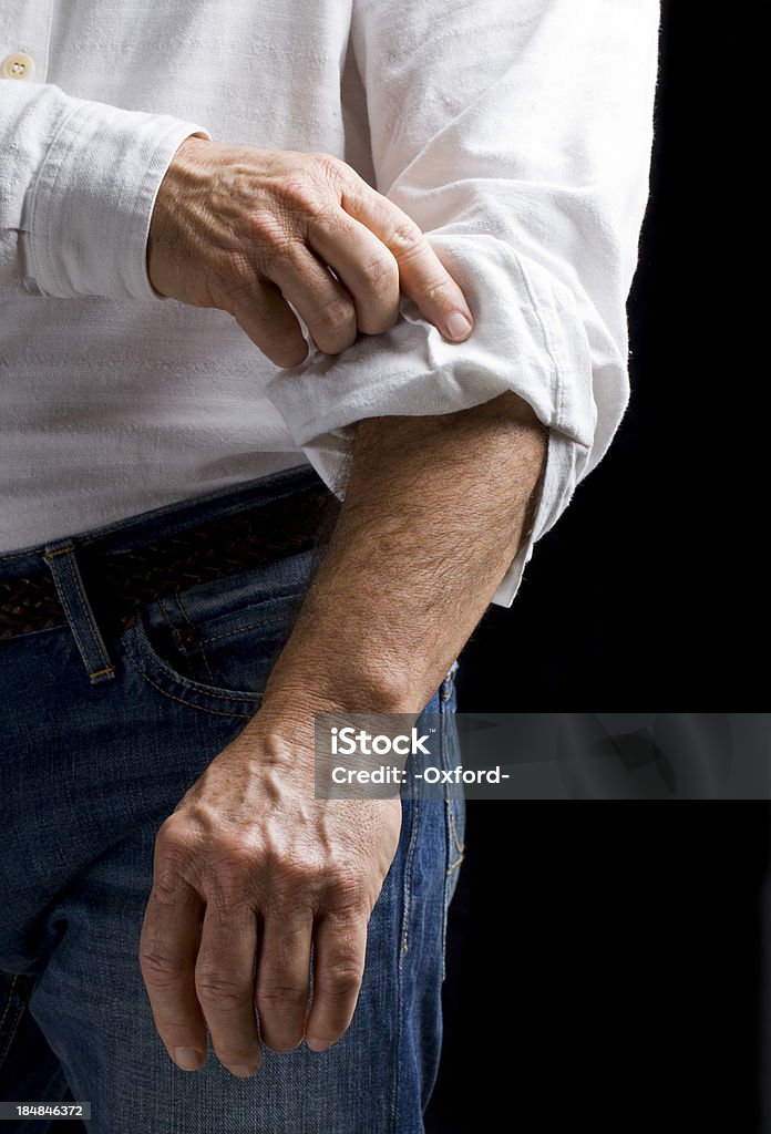 Ambition: Rolling up sleeve "Rolling up sleeve. Concept for ambition, taking charge, getting to work and others." Rolled-Up Sleeves Stock Photo