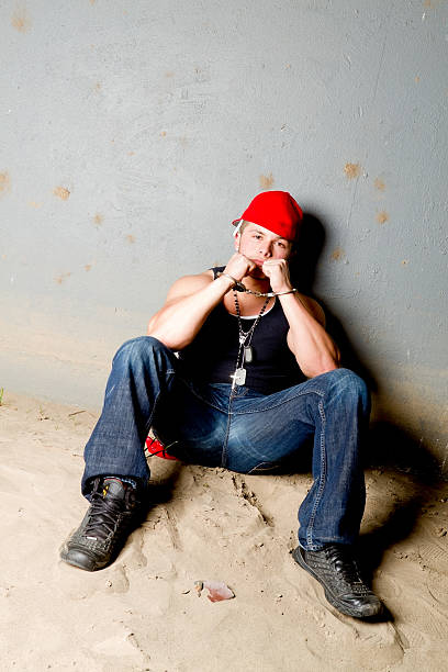 istock Street gang member wearing handcuffs 184847010