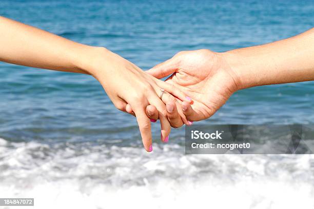 Holding Hands Stock Photo - Download Image Now - Adult, Beach, Beautiful People