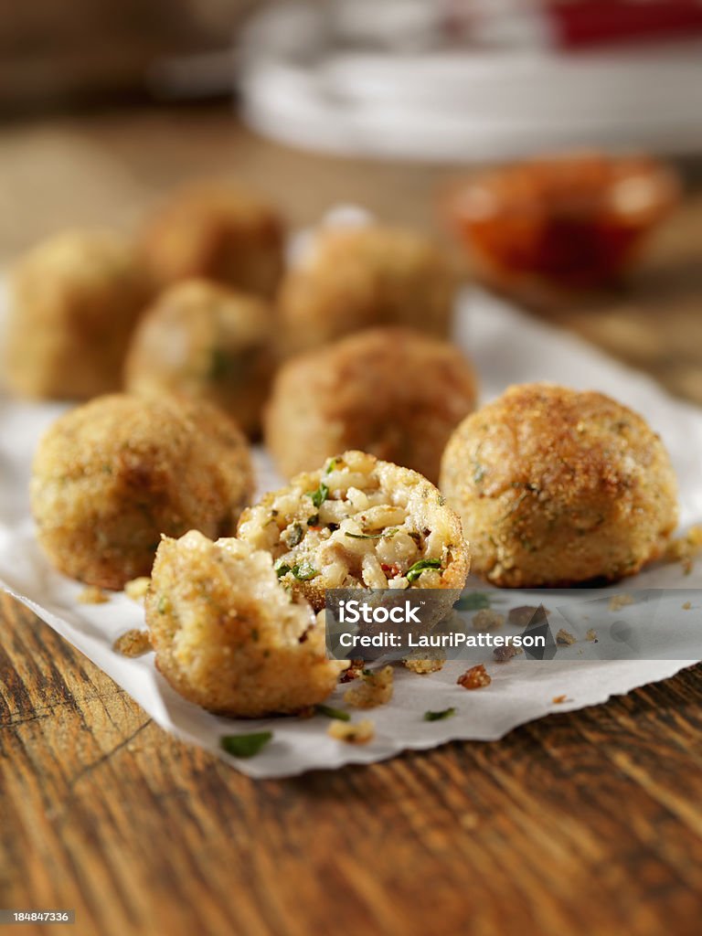 Arancini - Wikipedia Deep Fried Mushroom Risotto Balls with Fresh Italian Parsley and Parmesan Cheese-Photographed on Hasselblad H1-22mb Camera Rice Croquette Stock Photo