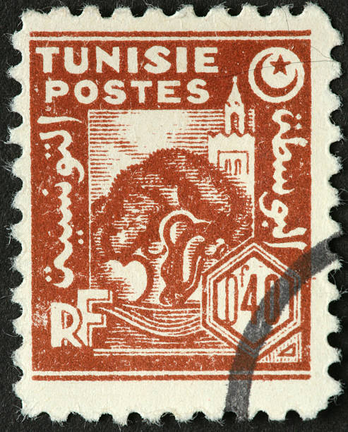 istock tree and tower on an old Tunisian postage stamp 184847536