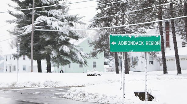 istock ADIRONDACK REGION Road Sign in Snow Blizzard 184847565