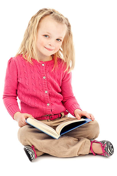 istock Little Girl Reading Book 184847856