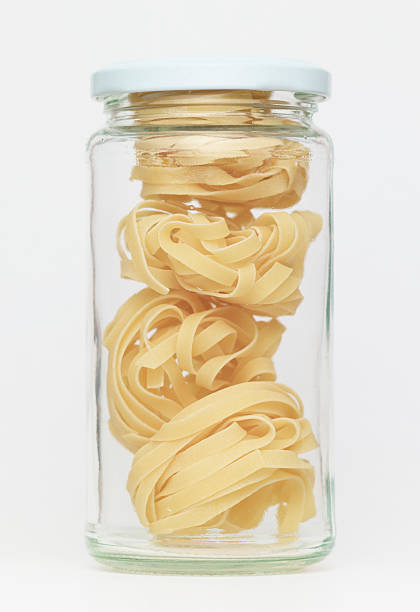 istock Pasta in glass jar on a white background 184848179