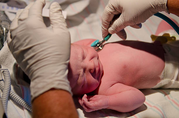 istock Newborn baby being checked by doctor 184848474