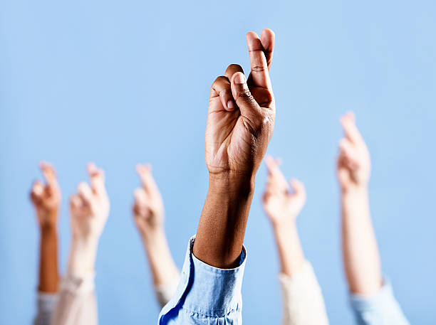 istock Keep your fingers crossed! Many hands ward off bad luck 184848615