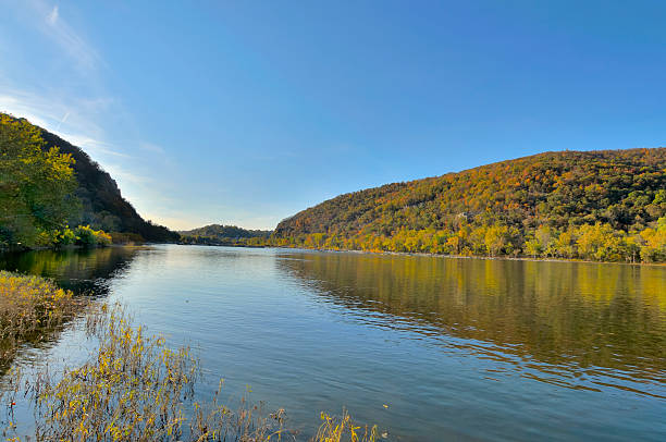 Potomac River Valley At Harpers Ferry Harpers Ferry nestles between Maryland Heights on your right and the Appalachians on the left. The Shenandoah river flows into the Potomac just beneath Harpers Ferry harpers ferry photos stock pictures, royalty-free photos & images