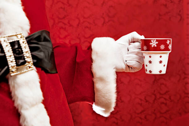 istock Santa holding a cup of coffee 184849996
