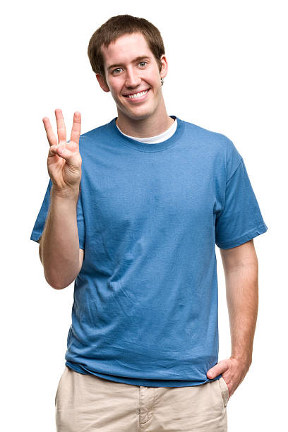 istock Smiling Young Man Shows Three Fingers 184850155