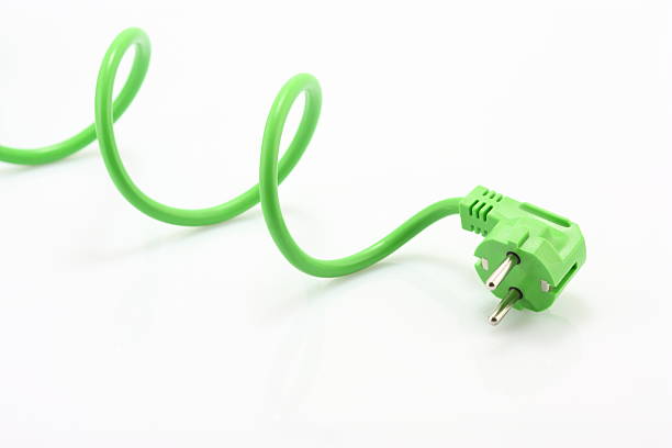 зеленый power вилка - electric plug electricity power cable power стоковые фото и изображения