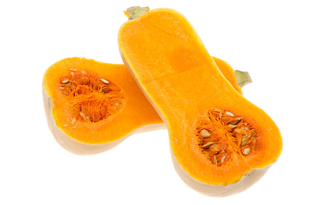 Butternut squash cut in half - shot in the studio with a white background