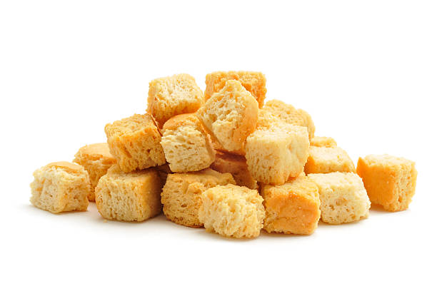 Croutons "Croutons in a pile, isolated on a white background." Croutons stock pictures, royalty-free photos & images