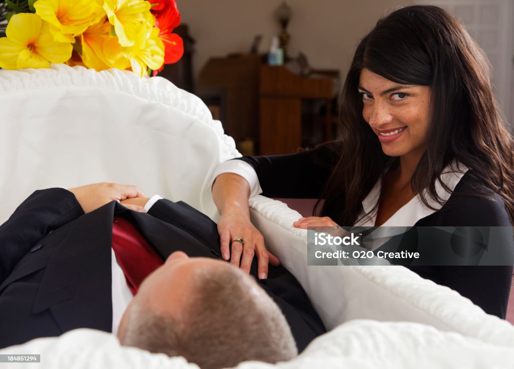 Mourning Woman A woman mourning over the death of a man at a funeral home. Funeral Stock Photo Mourning Woman A woman mourning over the death of a man at a funeral home. Funeral Stock Photo