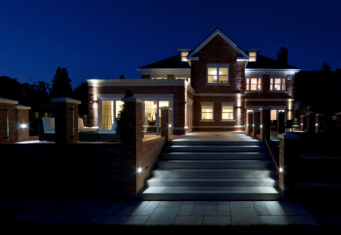 A night-time view of a beautiful new luxury home taken from the garden. All of the lights have been switched on and the image taken at the optimum time to obtain an intense twilight sky color.Looking for exterior views of Luxury Homes and Buildings... then please see my other images by clicking on the lightbox Link below...A>A