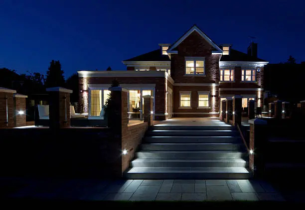 Photo of large luxury house at night