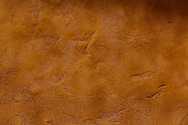 Rusted Stucco Texture Textured stucco roman wall detail. Great for background. copper wall stock pictures, royalty-free photos & images