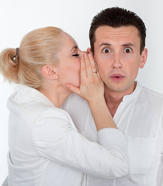istock Young couple in secret communication 184852015