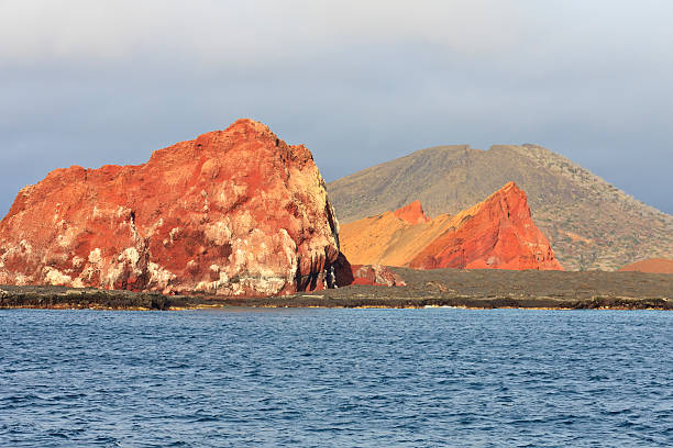Galapagos: Volcanic Landscape of Santiago Island "Galapagos: Volcanic Landscape of Santiago Island showing both basalt (orange) and tuff,My other  photos of  Galapagos Animals and Geology are in" isla san salvador stock pictures, royalty-free photos & images
