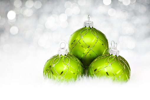 Green Baubles on snow