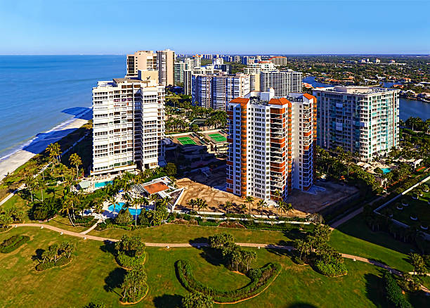 Gulf Shore Living "Condominiums on Gulf Shore Boulevard that are on the beach in Naples, Florida." collier county stock pictures, royalty-free photos & images