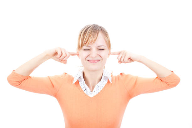istock Young annoyed woman closing her ears with fingers 184854286