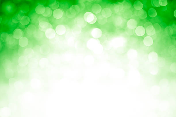 istock Blurred green sparkles background with darker top corners, bright center 184854391